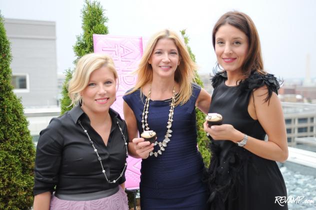 Georgetown Cupcake's Sophie LaMontagne and Katherine Kallinis flank best-selling author Candace Bushnell.